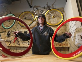 Brendan McAndrew, owner of the White Pine Bicycle Company, with some bikes in his store at The Forks.  Tuesday, October  28, 2014.  (Chris Procaylo/Winnipeg Sun/QMI Agency)