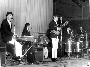 The Dave Clark Five ? Mike Smith, left, Clark, guitarist Lenny Davidson, sax player Denis Payton and bassist Rick Huxley ? rock Treasure Island Gardens Nov. 3, 1964.
