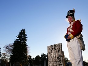 Peter Johson of Stockdale, Ont. stands at the grave of his great-great-grandfather, War of 1812 soldier John Johnson, in Stockdale Cemetery Sunday, November 2, 2014. He said there are about six veterans of the war buried in the cemetery.
