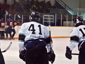 (L to R) Marty Wicks, Hayden Shackel and Mason Bond skate back toward the Huskies' bench to celebrate Shackel's second period goal - the fourth for the Huskies. Greg Cowan photos/QMI Agency.