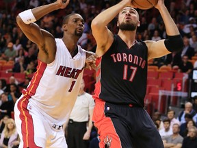 Heat forward Chris Bosh (left) defends against Raptors centre Jonas Valanciunas in Miami on Sunday. (USA TODAY Sports)