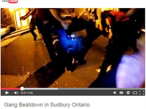 Screen capture of a YouTube video depicting a fight outside a rave at the Navy League hall in June.