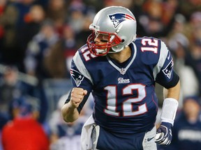 New England Patriots quarterback Tom Brady (12) pumps his fist after a touchdown throw during the third quarter of New England's 43-21 win over the Denver Broncos at Gillette Stadium. (Winslow Townson-USA TODAY Sports)