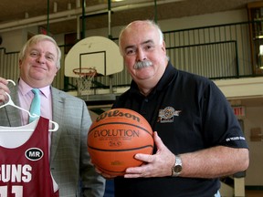 Paul Proderick, principal of St. Patrick School and Roland Billings, president of the Knights of Columbus Basketball League, inside the school's gym in Kingston. (Ian MacAlpine/The Whig-Standard)