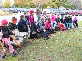 Mrs. Simpson’s Grade 3 class sits on furs as they listen to Mrs. Dockstader talk. (Steph Smith/Goderich Signal Star)