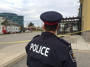 Police at the scene of a fatal shooting in a Richmond Hill plaza Monday, Nov. 3, 2014. (Stan Behal/Toronto Sun)