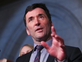 NDP MP Paul Dewar speaks to the media in Ottawa, March 26, 2013. (QMI Agency)