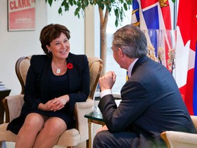 Alberta Premier Jim Prentice (R) meets with B.C Premier Christy Clark in Vancouver, British Columbia November 3, 2014. REUTERS/Ben Nelms