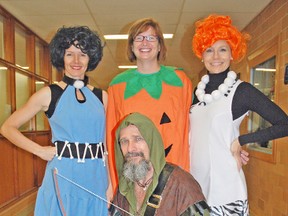 Students and staff at Mitchell District High School (MDHS) got into the spirit of Halloween last Friday, Oct. 31, dressing in costumes for the day. Staff took a moment to show off, including Principal Emma Bannerman (left), EA Jacquie Mohr, Vice-Principal Kim Crawford and Physical Education teacher Bob Ellison. The question is – did they receive any treats from the students? KRISTINE JEAN/MITCHELL ADVOCATE