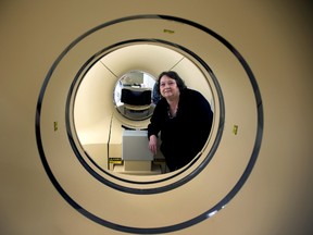 Heart patient Valerie Bott looks through the scanner during a tour of the Position Emission Tomography (PET) at the Mazankowski Heart Institute in Edmonton, Alberta on Monday, November 3, 2014. Perry Mah/Edmonton Sun
