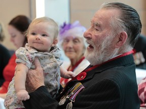 The Order of St. George Investitude ceremony was held at the Perley Rideau in Ottawa Monday Nov 3,  2014. Leslie Bowley holds his great grand-daughter Mallory after receiving the The Order.
Tony Caldwell/Ottawa Sun/QMI Agency