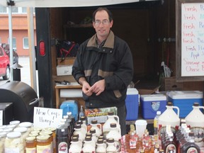 Emerson Bowman of Wallenstein sells hormone free beef, free-run eggs and sausage on a bun at the Emira Farmers' Market. He said he has had a great year and looks forward to returning next year.