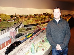 Mike Craig, executive director, stands by the expansive train layout. (Jim Fox/Special to QMI Agency)