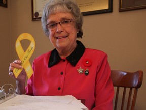 Wilma McNeill has fought for 25 years to return Nov. 11 to the status of a statutory holiday in Ontario. The 83-year-old Sarnia woman, pictured here with decades of letters, is optimistic her grassroots campaign will be successful in light of NDP MP Dan Harris' private members' bill to be voted on Wednesday. (BARBARA SIMPSON, The Observer)