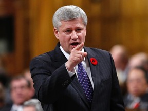 Prime Minister Stephen Harper speaks during Question Period in the House of Commons on Parliament Hill in Ottawa, Nov. 4, 2014. (CHRIS WATTIE/Reuters)