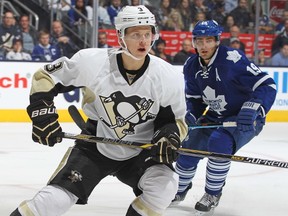 Olli Maatta of the Pittsburgh Penguins defends against the Toronto Maple Leafs during an NHL game at the Air Canada Centre on October 11, 2014. (Claus Andersen/Getty Images/AFP)