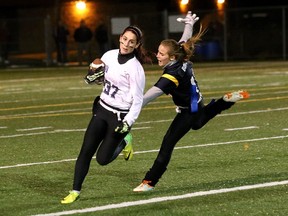 JOHN LAPPA/THE SUDBURY STAR/QMI AGENCY
Keagen McCoshen, left, of the Marymount Regals, evades Sophia Borges, of the College Notre-Dame Alouettes, during the high school girls flag football division A championship game at the James Jerome Sports Complex on Tuesday evening.