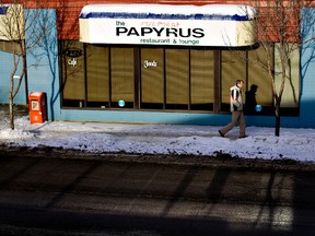 A pedestrian walks past Papyrus restaurant, 107 Avenue and 112 Street in Edmonton, Alta., on Monday, January 3 2011.  Papyrus is the scene of Edmonton's latest homicide.EDMONTON SUN