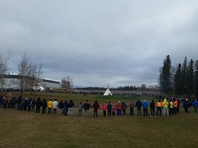 Pimicikamak Cree Nation protesters join hands outside Jenpeg in this October Facebook photo.