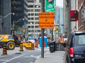 Vehicle traffic is reduced to one lane due to construction  along Adelaide St W in downtown Toronto, Ont.  on Tuesday November 4, 2014. Ernest Doroszuk/Toronto Sun/QMI Agency