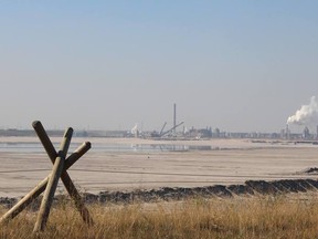 A former active tailings pond viewed from Highway 63, with a Syncrude Canada facility in the background. VINCENT MCDERMOTT/TODAY STAFF