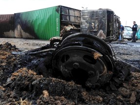 People look at the wreckage of vehicles after a bus crashed in Damanhur November 5, 2014. (REUTERS/Al Youm Al Saabi Newspaper)