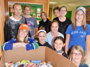 Kristy Illman’s Grade 7 and 8 Community Outreach Team collected canned goods for the local foodbank with their We Scare Hunger campaign.