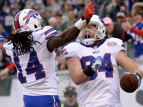 Buffalo Bills tight end Scott Chandler (84) celebrates with wide receiver Sammy Watkins (14) after scoring a touchdown against the New York Jets in the second half at MetLife Stadium. (Robert Deutsch-USA TODAY Sports)