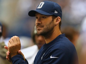 Tony Romo #9 of the Dallas Cowboys on the sidelines during a game against the Arizona Cardinals at AT&T Stadium on November 2, 2014 in Arlington, Texas.  (Ronald Martinez/Getty Images/AFP)