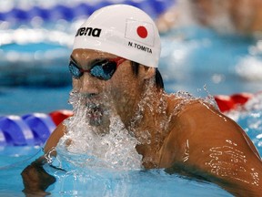 Japan’s Naoya Tomita competes in the men’s 200-metre breaststroke semifinal at the World Championships in Shanghai in this July 28, 2011 file photo.  (REUTERS/Bobby Yip/Files)