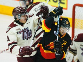 Belleville Bulls captain Jake Marchment (right) was suspended 15 games by the OHL for inappropriate language directed at a woman in an online conversation. (Clifford Skarstedt/QMI Agency/Files)