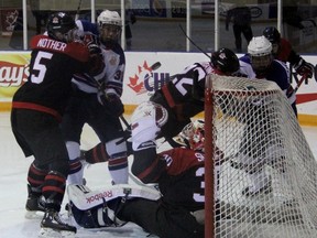 Canada Black goaltender Stuart Skinner keeps his eye on the puck fluttering above him with heavy traffic around his crease. Team USA defeated Canada Black 4-1 in a World Under-17 Hockey Challenge quarter-final Thursday afternoon in Lambton Shores. (TERRY BRIDGE/THE OBSERVER)