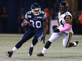 Tiger-Cats linebacker Taylor Reed (44) earned the top rookie of the year award in The Hammer for 2014. (Dave Sandford/Getty Images)