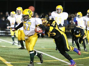 Lively Hawks' Jeremy Welsh takes down Confederation Chargers Hunter Busch during the high school junior football championship game Thursday night at the James Jerome Sports Complex.