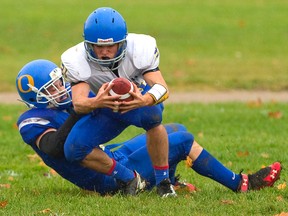 Grayson Jacklin of the Oakridge Oaks tackles Harry Weisdorf of the Beal Raiders during the Oaks? 50-6 win Thursday in their Thames Valley Central quarterfinal game at Oakridge secondary school. (Mike Hensen/The London Free Press)