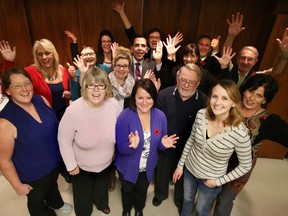 The ATCO Edmonton Sun Christmas Charity Auction team celebrates raising over $163,000 in support of  the Stollery Children's Hospital Foundation, United Way, the Christmas Bureau and Catholic Social Services Sign of Hope campaign at the Christmas Bureau head office, 4230 118 Ave NW, in Edmonton, AB on Thursday, November 6, 2014. TREVOR ROBB/EDMONTON SUN/QMI AGENCY