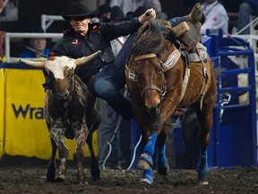 Cody Cassidy (Donalda, AB) wins the second go round of the steer wrestling competition at the Canadian Finals Rodeo at Rexall Place, in Edmonton Alta., on Thursday Nov. 6, 2014. David Bloom/Edmonton Sun/QMI Agency