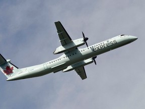 An Air Canada Express Bombardier Q400 takes off at Edmonton International Airport in Leduc, Alta., on Wednesday, Aug. 14, 2013. (Ian Kucerak/Edmonton Sun/QMI Agency files)