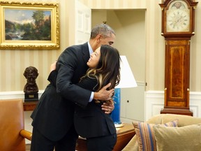 U.S. President Barack Obama hugs Dallas nurse Nina Pham at the Oval Office in Washington, October 24, 2014.  Obama gave a big hug on Friday to Nina Pham, the Dallas nurse who survived a bout with Ebola.

REUTERS/Larry Downing