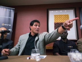 Former Major League Baseball player Jose Canseco speaks next to former Canadian Olympian Ben Johnson (2nd R) during a round table discussion regarding the prevalence of performance-enhancing drugs in sports, in New York September 4, 2013. (REUTERS/Lucas Jackson)