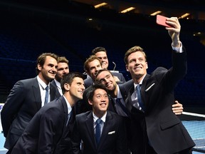 Tomas Berdych (right) takes a ‘selfie’ with fellow players Roger Federer, Stan Wawrinka, Novak Djokovic, Kei Nishikori, Andy Murray, Milos Raonic and Marin Cilic at the O2 Arena in London November 7, 2014. (REUTERS/Toby Melville)
