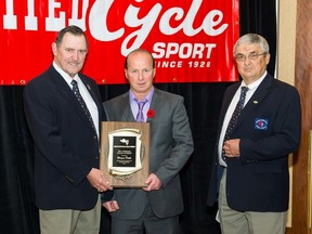 Wayne Duke (right) and Rick Kampjes of the Edmonton International Baseball Foundation pose with the Bill Chmilar Award of Merit on Nov. 1. Duke was recognized for his lasting contributions to the development and betterment of amateur baseball in Alberta. - Photo Supplied