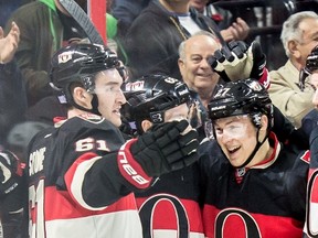 Senators Mark Stone, Mike Hoffman and Curtis Lazar celebrate a goal Thursday night. (USA TODAY SPORTS)