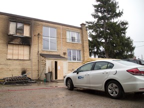 Building restorationists were at 1451 Oxford St. in London, Ontario on Thursday, November 6, 2014. (DEREK RUTTAN, The London Free Press)