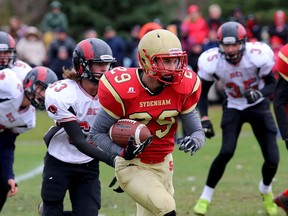 Golden Eagles’ Brodie Latimer runs for yardage against the Brockville Red Rams during an Eastern Ontario high school semifinal football game in Sydenham on Friday. Sydenham won 31-28. (IAN MACALPINE/THE WHIG-STANDARD)