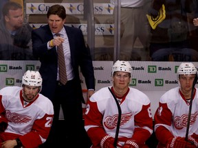 Detroit Red Wings coach Mike Babcock points to the ice during Game 2 of the first round playoff series against the Boston Bruins at TD Banknorth Garden. (Greg M. Cooper/USA TODAY Sports)