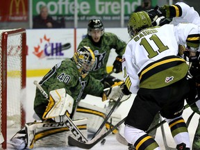 Kingston Frontenacs goalie Lucas Peressini makes a save on North Bay Battalion's Mike Baird during Ontario Hockey League action at the Rogers K-Rock Centre on Friday. (Ian MacAlpine/The Whig-Standard)