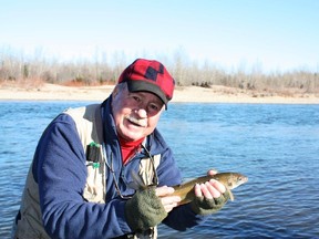 Neil with a Red Deer River Mountain Whitefish. (Neil Waugh photo)