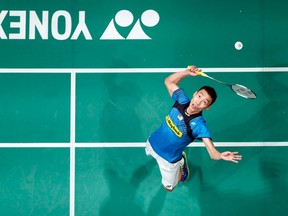Malaysia’s Lee Chong Wei hits a return during the men’s singles final against Indonesia’s Tommy Sugiarto at the Malaysian Open Super Series badminton tournament in Kuala Lumpur in this January 19, 2014 file photo. (REUTERS/Samsul Said/Files)