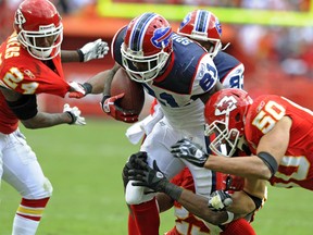 Buffalo Bills wide receiver Marcus Easley is brought down by Kansas City Chiefs safety Eric Berry and linebacker Mike Vrabel (right) during their NFL game at Arrowhead Stadium in Kansas City, Missouri  October 31, 2010. (REUTERS file photo)